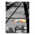 Colour composite. Beach scene with a colourful umbrella. Boracay, the Philippines.